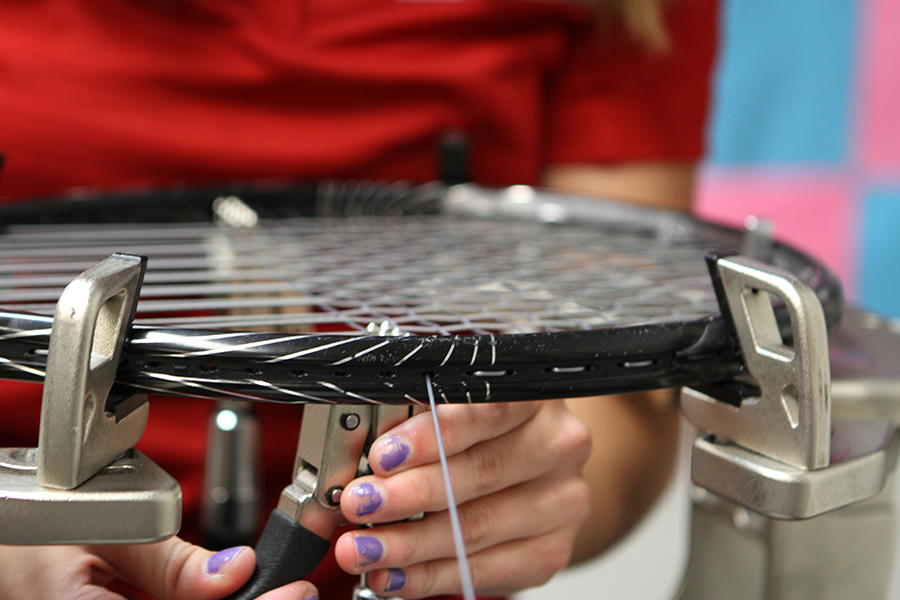 Photo of a tennis racquet being restrung