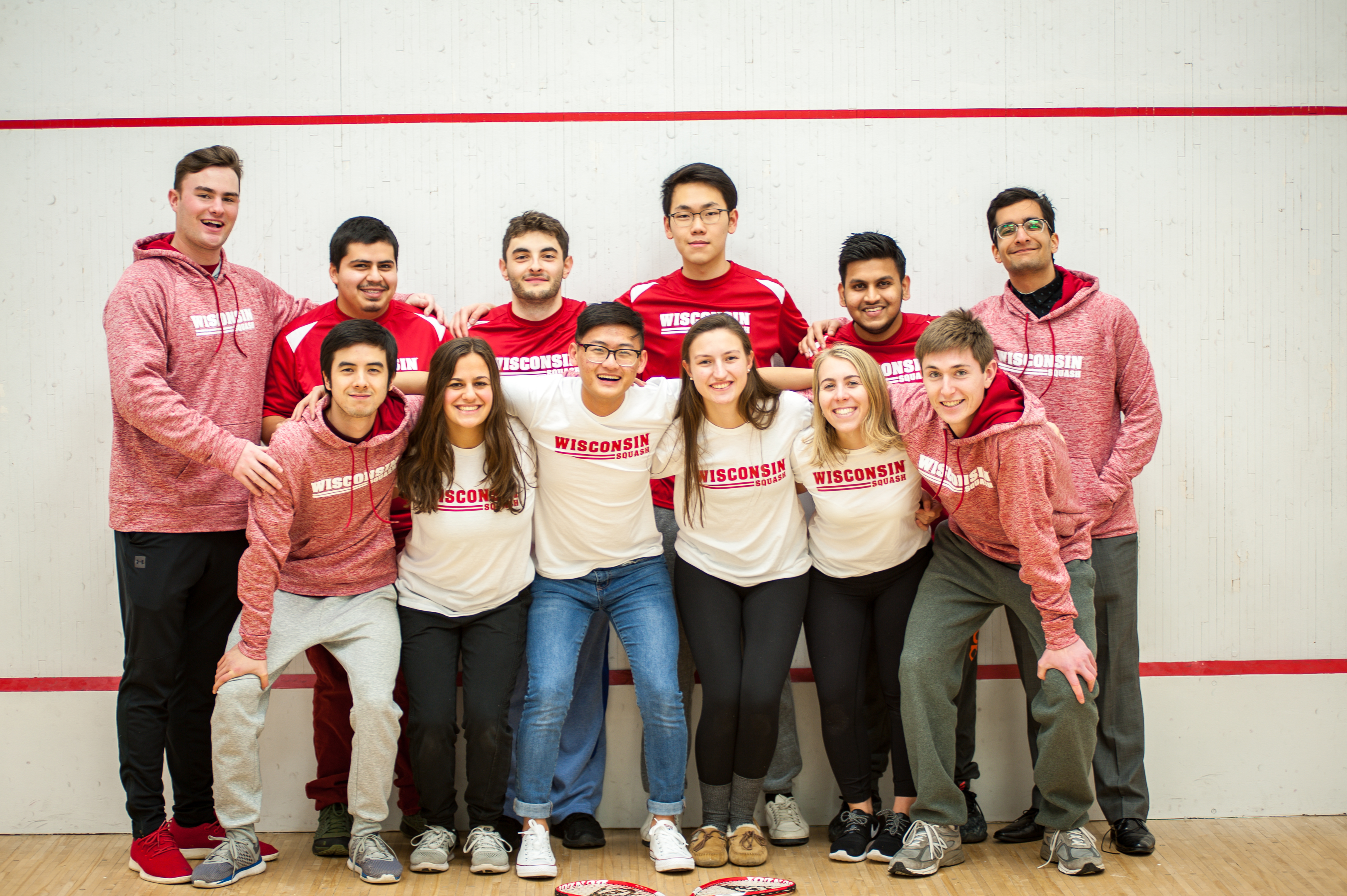 Photo of the UW Golf Team standing together wearing matching Wisconsin apparel