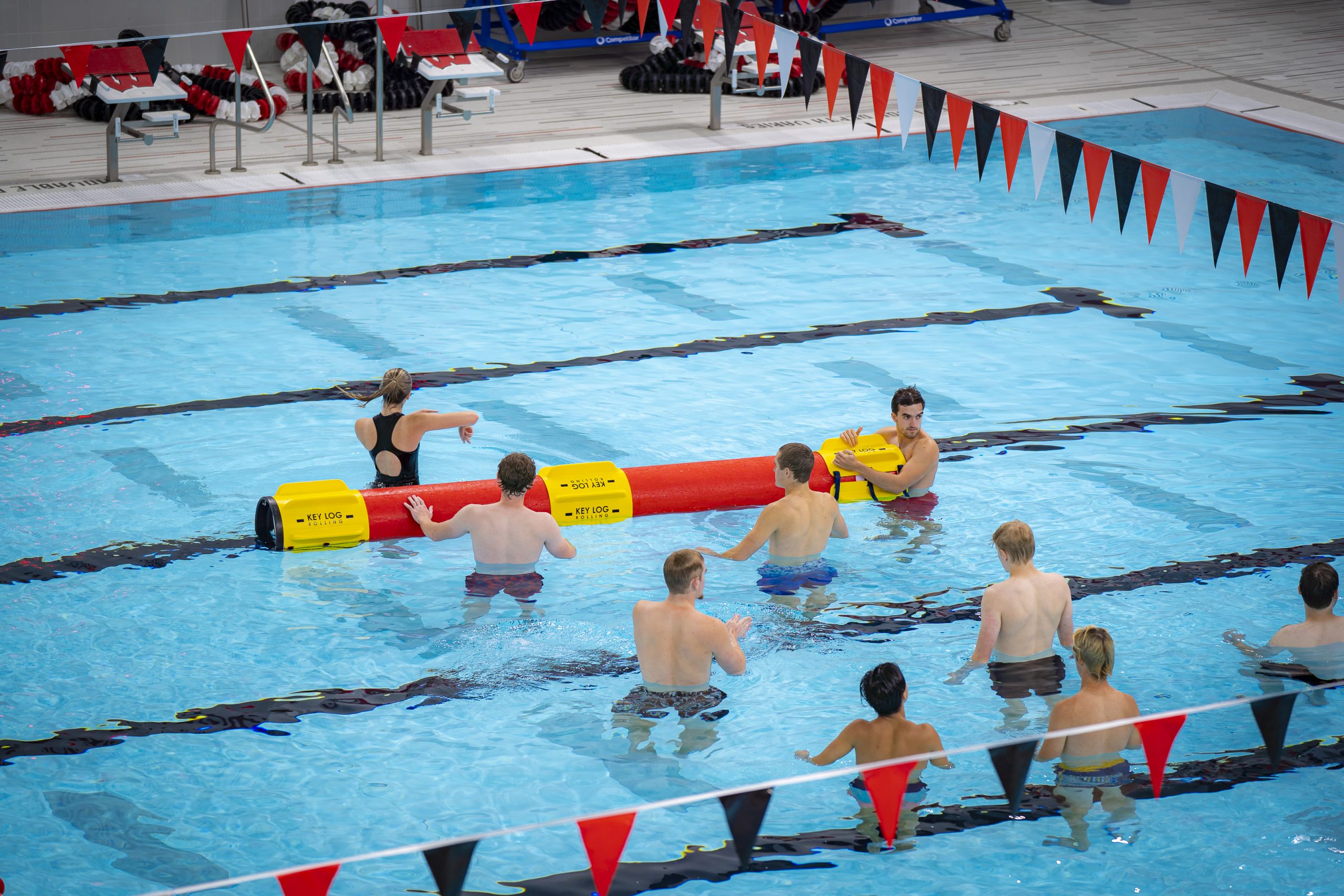 A photo of a log rolling log in the pool at the Nick