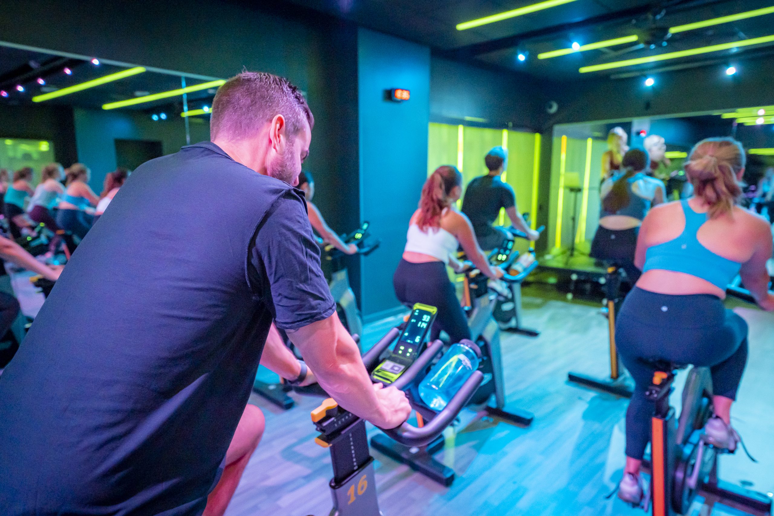 Image of a cycling class in the Revolution Studio at the Nicholas recreation and Wellbeing Center.