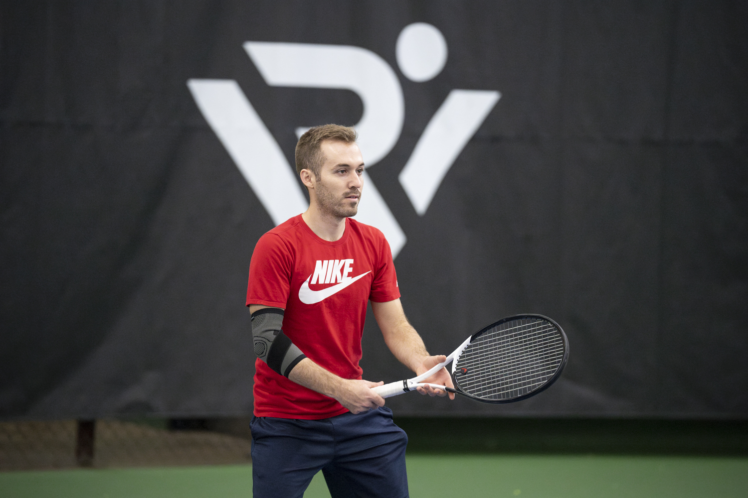 RecWell member playing tennis at the Nielsen Tennis Stadium