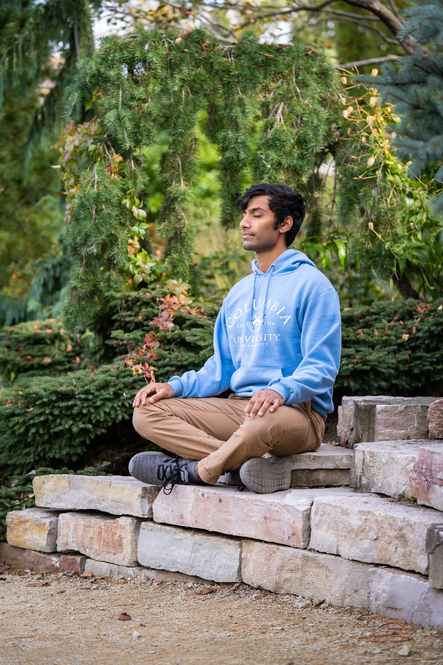 Image of person meditating in Allen Centennial Garden