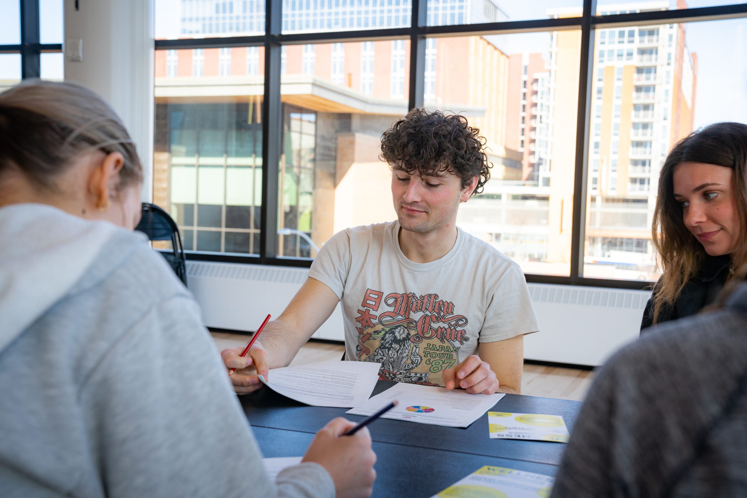 Members at a workshop filling personal wellbeing assessment sheet