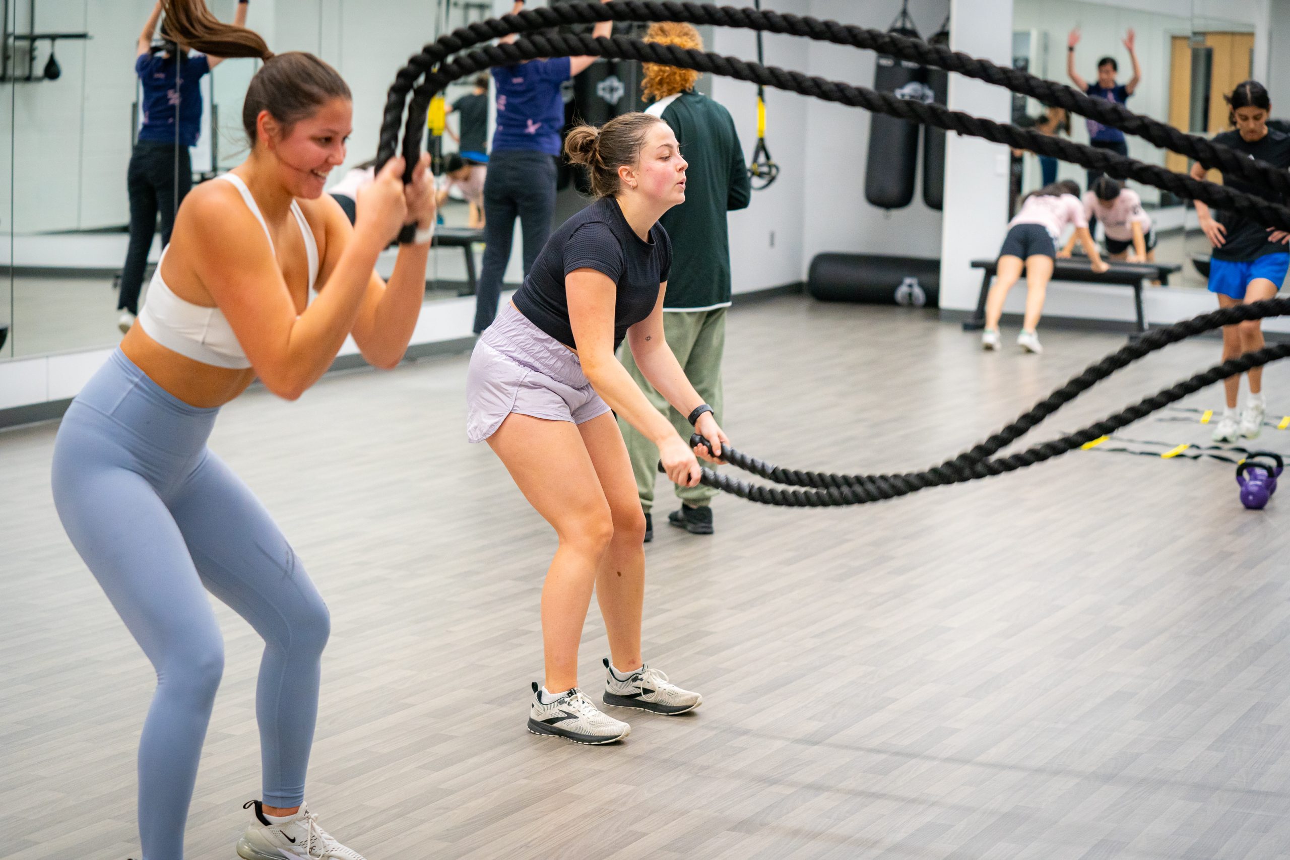 Train360 class participants using the ropes.