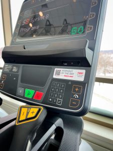 A Workout of the Day sticker from Treo Fitness is highlighted on a cardio machine at Bakke.