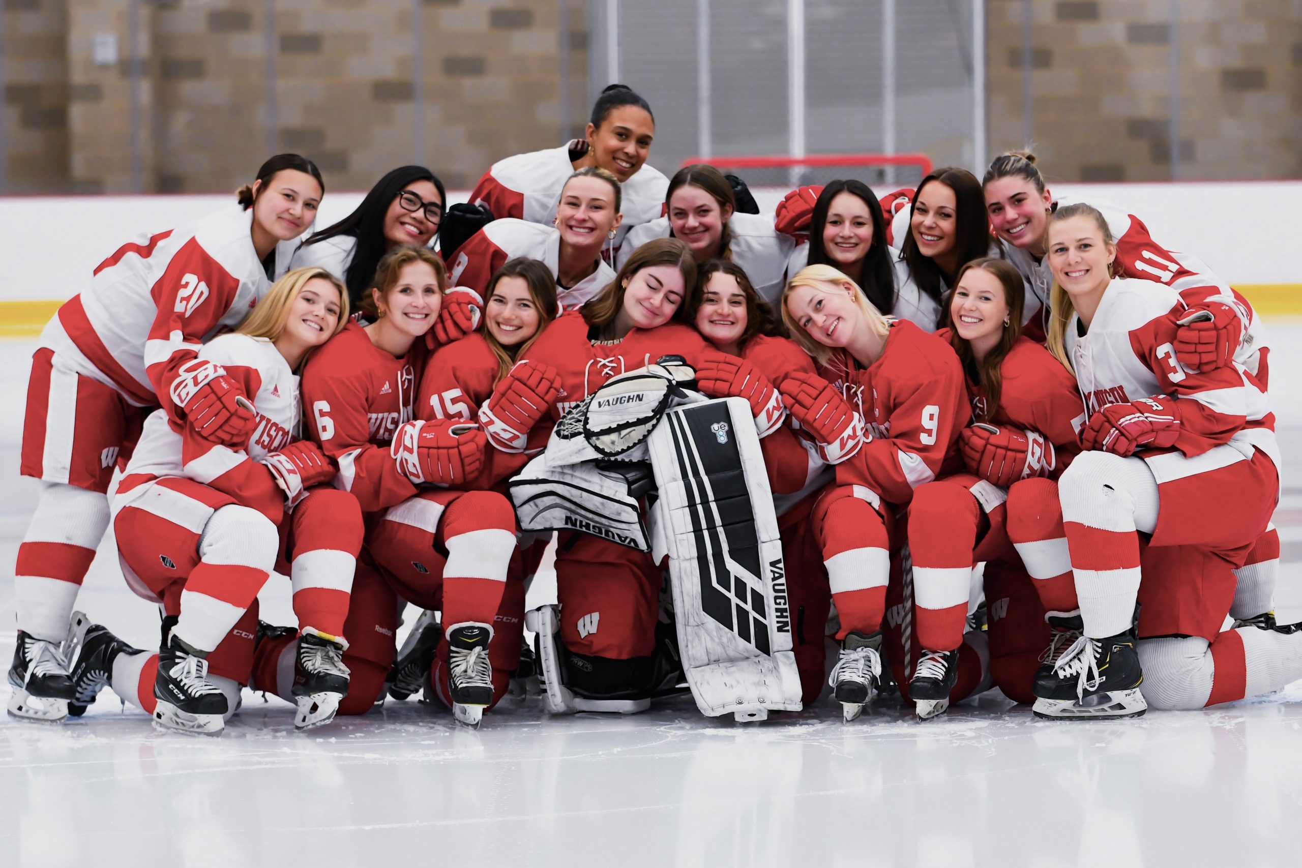 Group photo of the club women's hockey team in their gear.