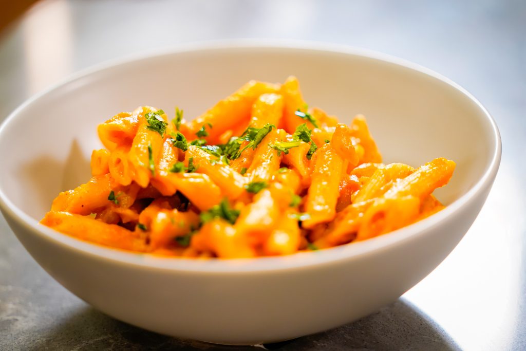 Creamy Autumn Pumpkin Pasta sitting in a bowl