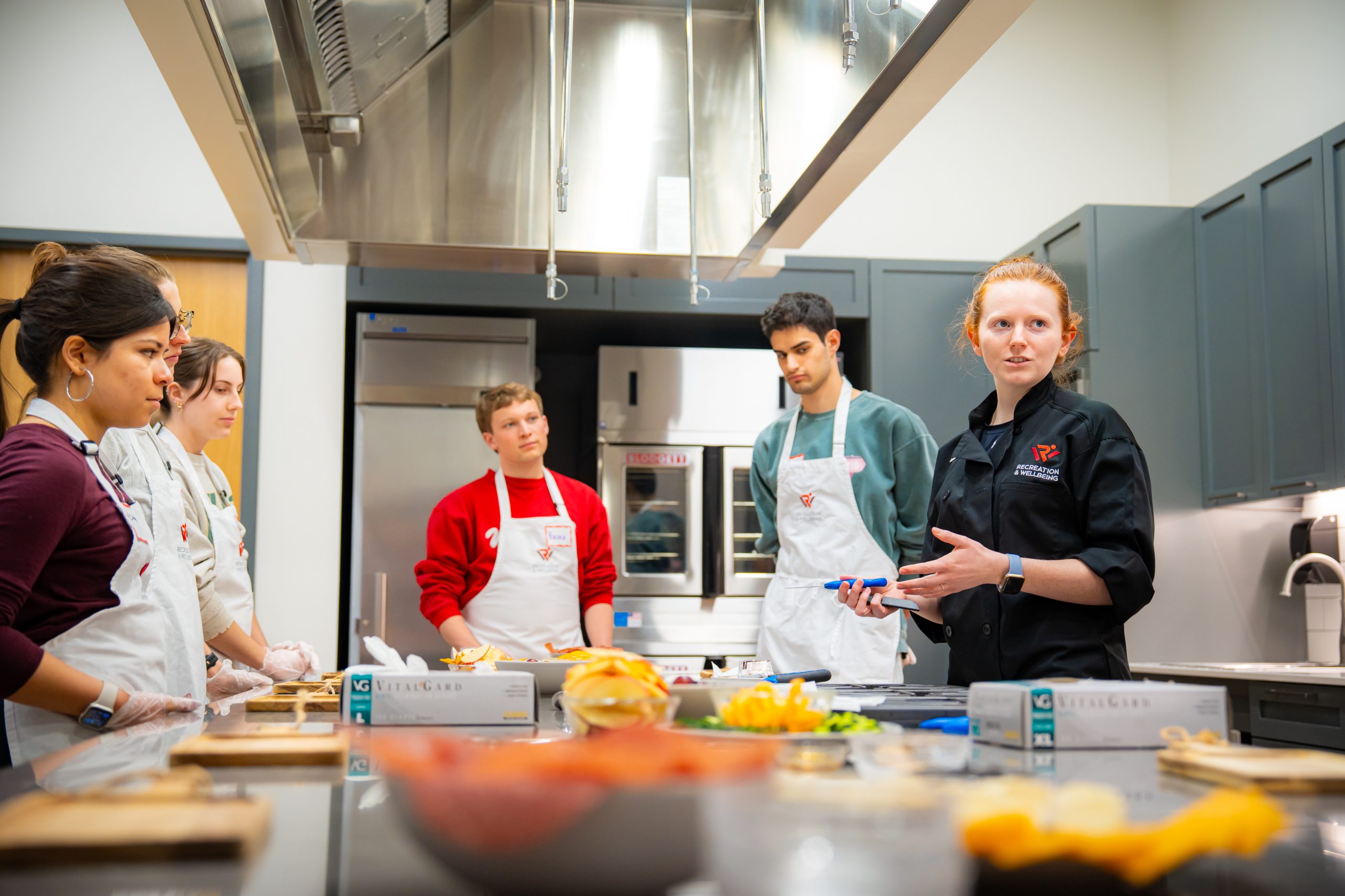 Rec Well members participate in a Badger Bites class covering charcuterie and mindful eating at the Bakke Recreation and Wellbeing Center.