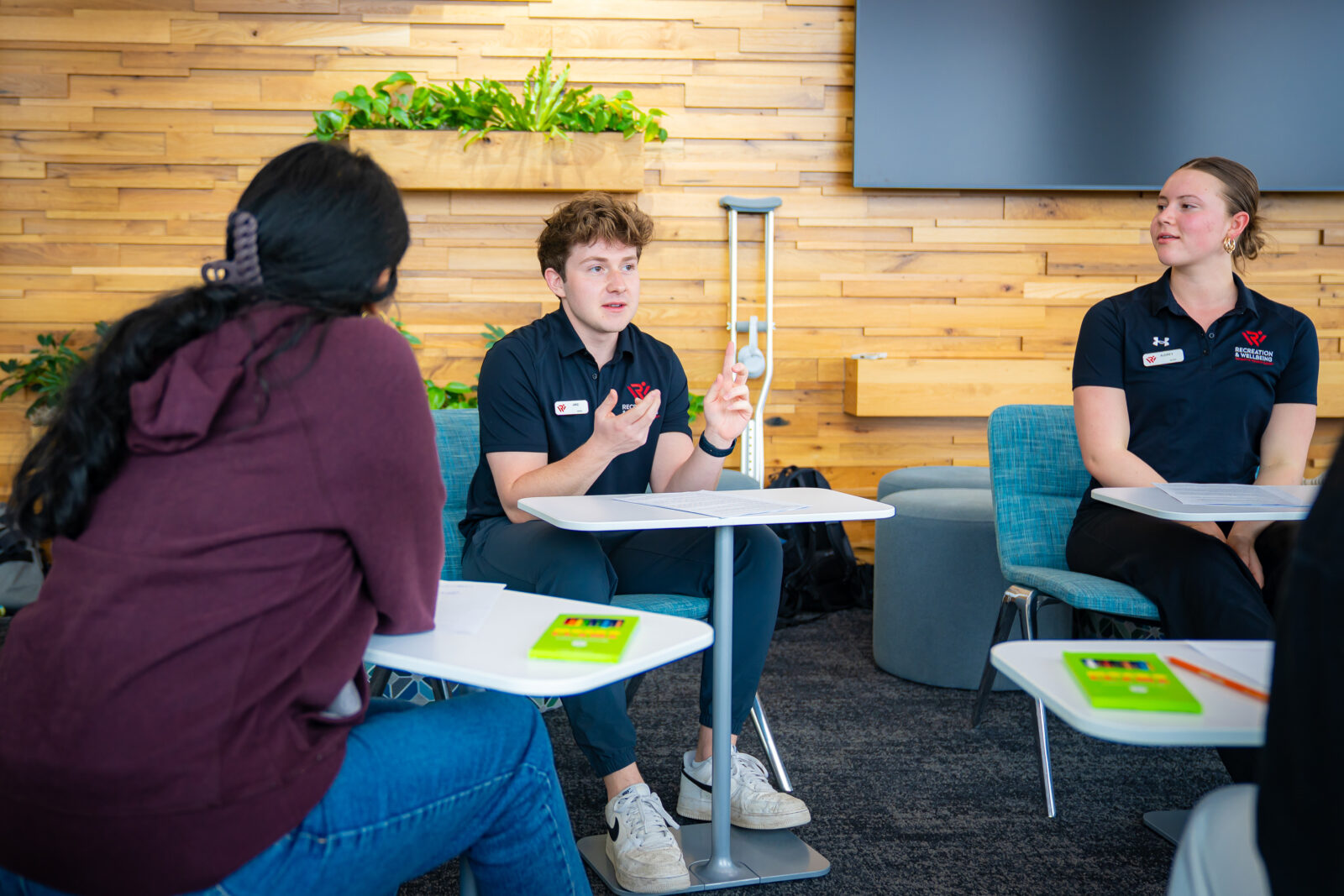 Wellness coaches lead a group coaching session for clients