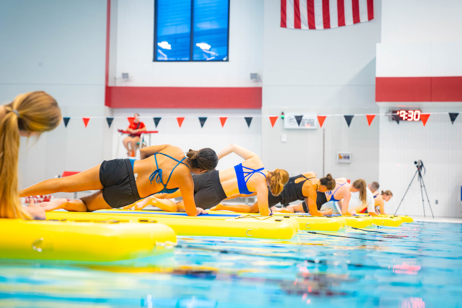 An image of members on stand up paddleboards in the pool at the Nicholas Recreation Center.